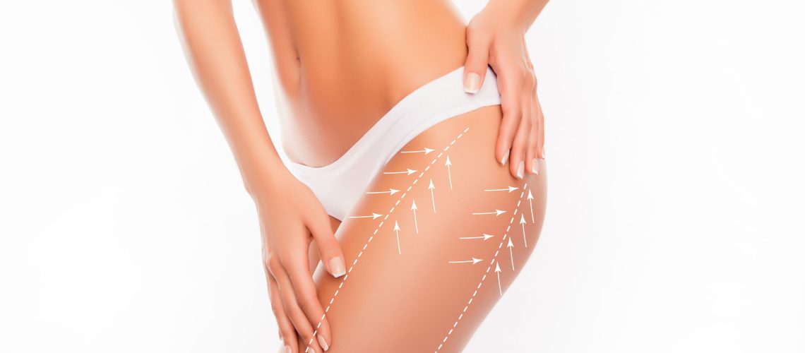 Beautiful slim fit woman touching her body with arrows isolated on white background